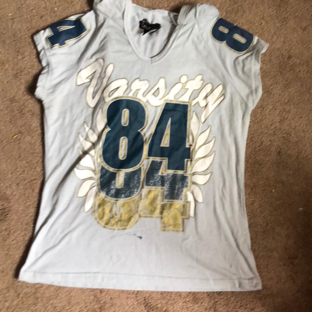 Varsity 84 shirt.